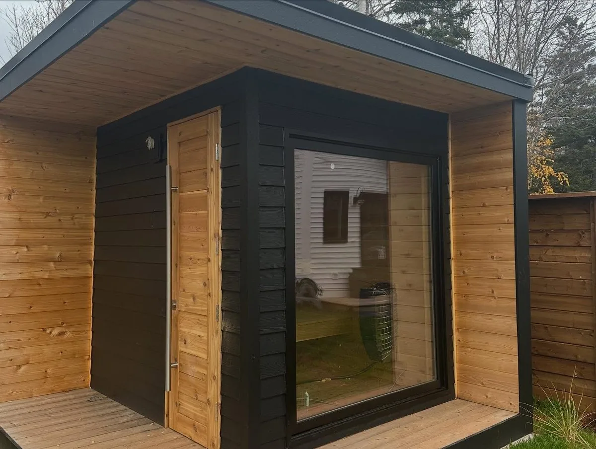 The sauna exterior with its glass front and cedar walls